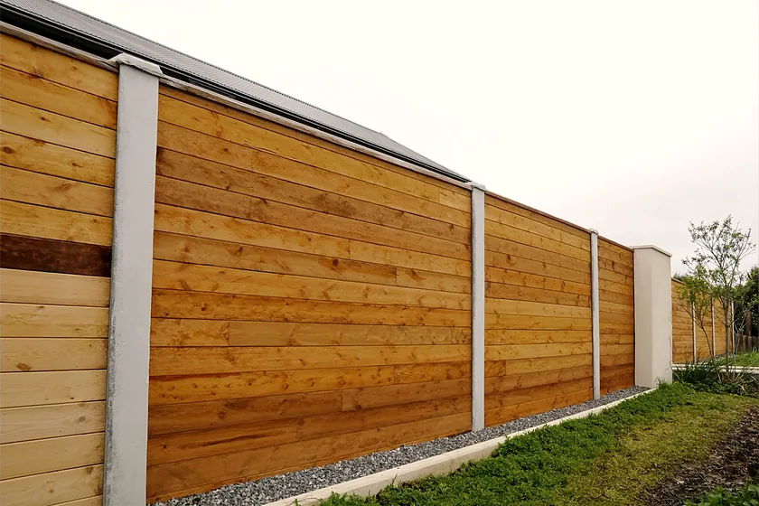 Concrete post and panel fencing around a garden