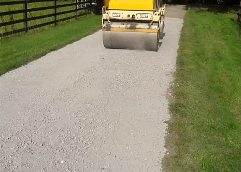 Tar and gravel driveway being rolled in Garryhill, Co. Carlow