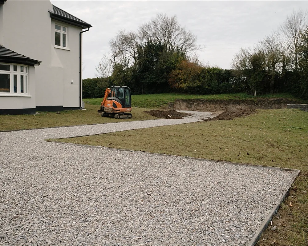A cleared and levelled site with a stone base