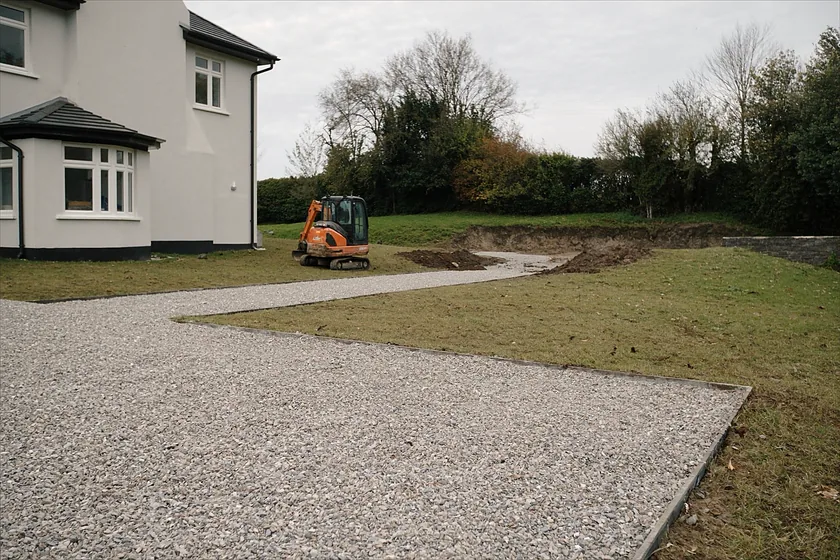 A cleared and levelled site with a stone base