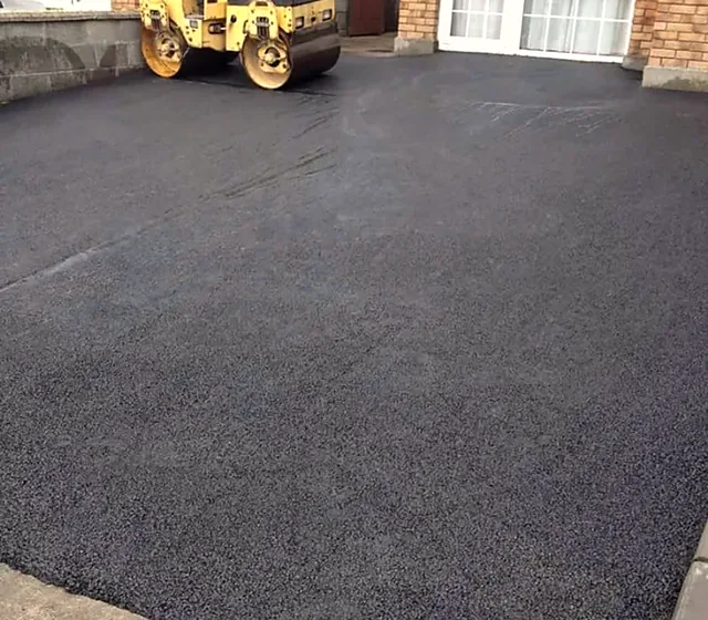Tarmacadam driveway being rolled in Carrick-on-Suir, Co. Tipperary