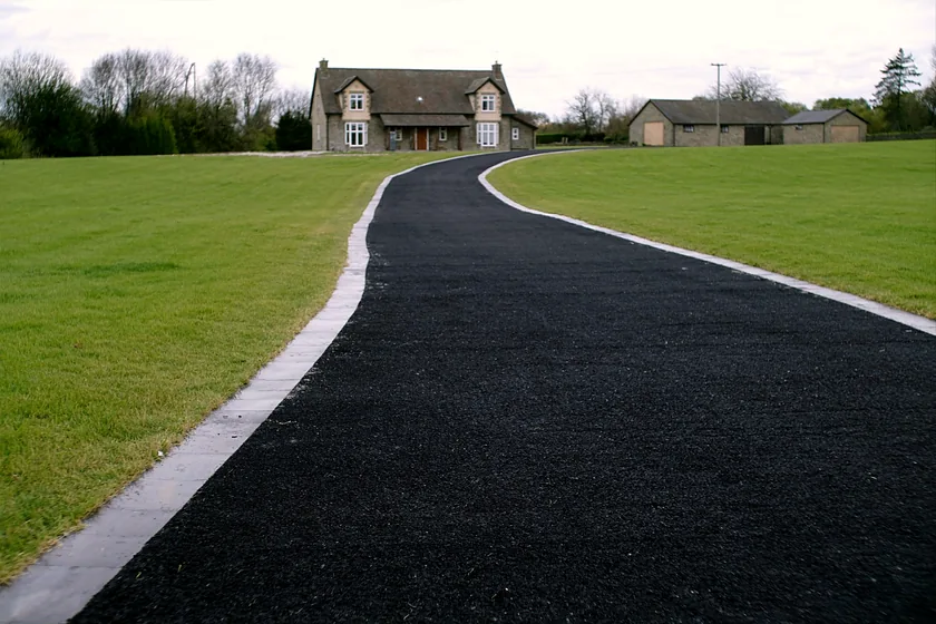 A new tarmacadam driveway at a farmhouse