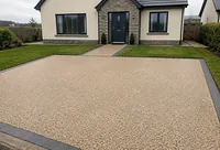 A resin bound driveway with a dark border